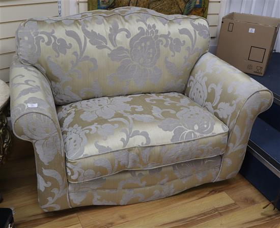 An upholstered love seat armchair, no feet W.132cm